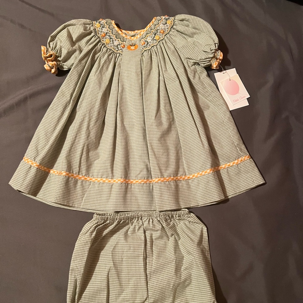 Smocked baby fall dress w undies. Green plaid w pumpkins and orange trim 9 mths